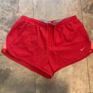 red/ coral Nike running shorts